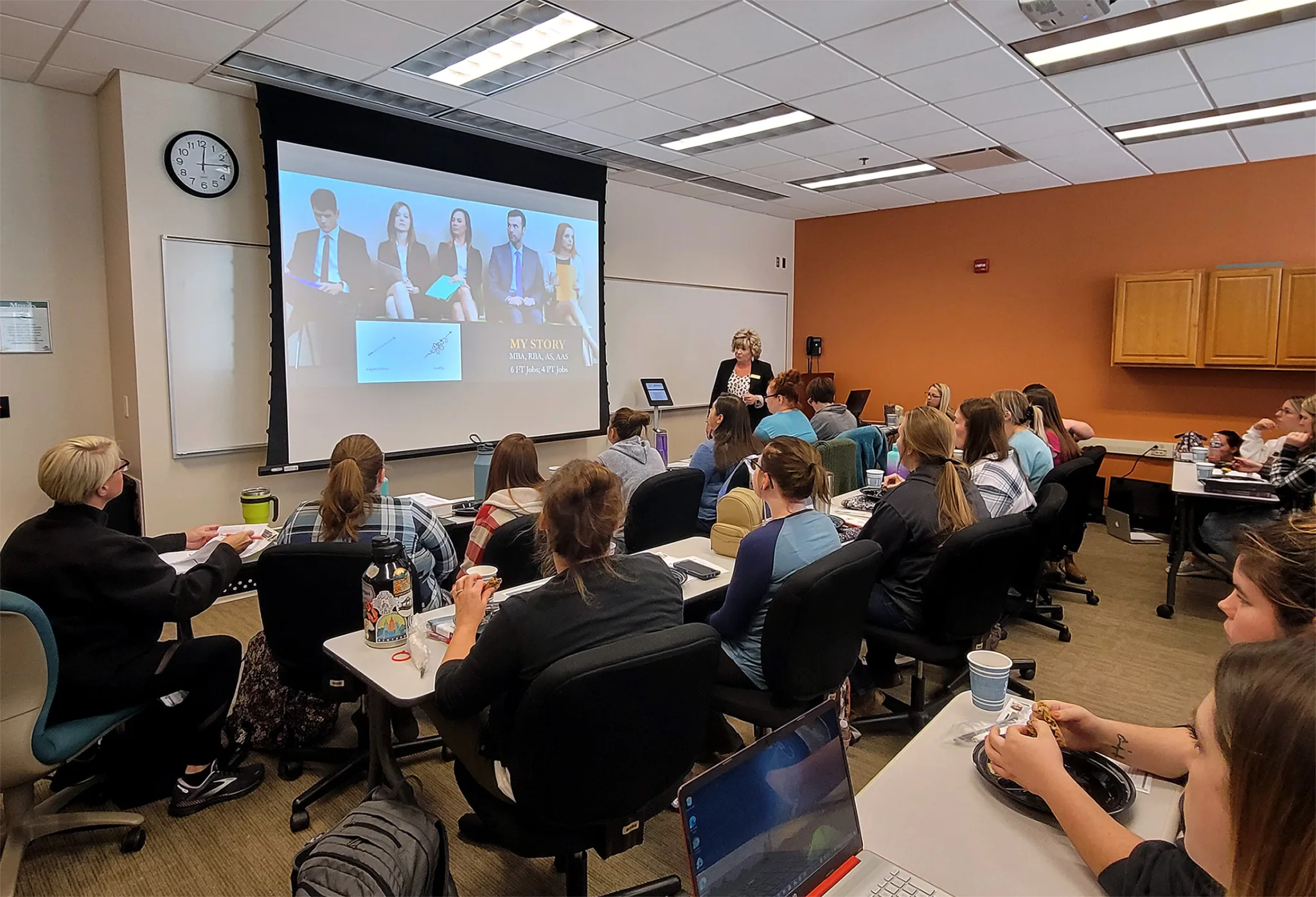 Woman teaching students