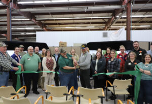 group of people at a ribbon cutting