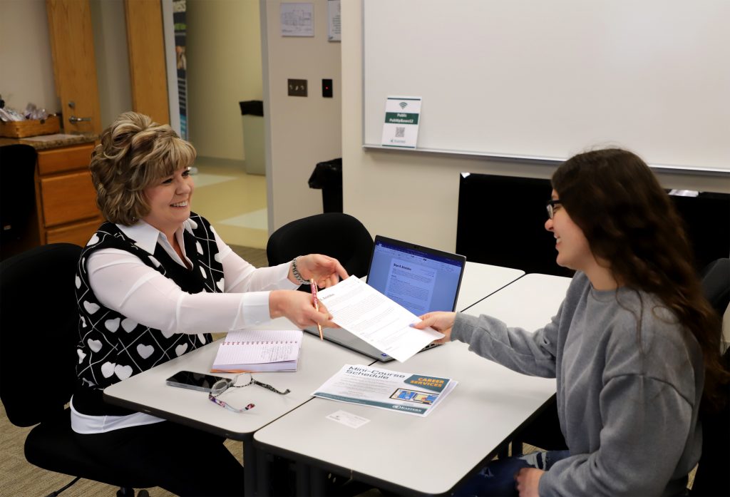 Career counselor and student working