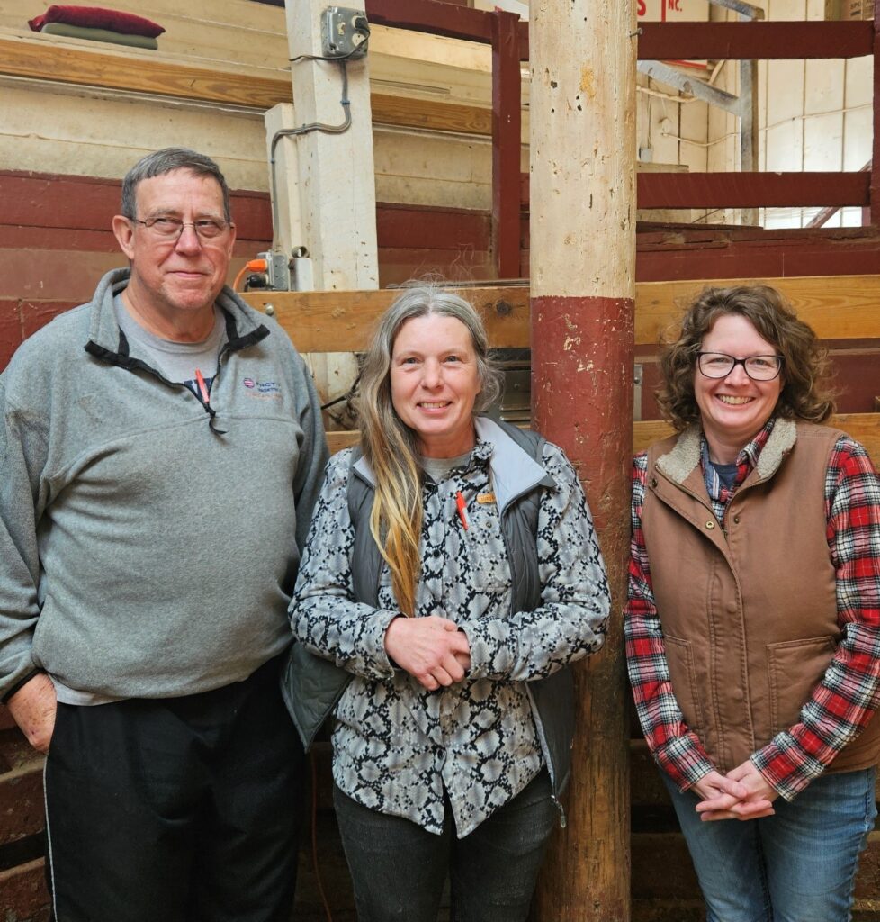 portrait of a man and two women